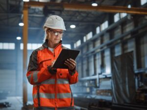 A construction employee utilizes construction software integration services