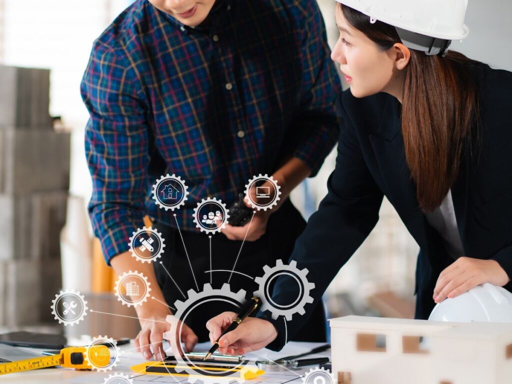 Two workers utilize construction efficiency tools